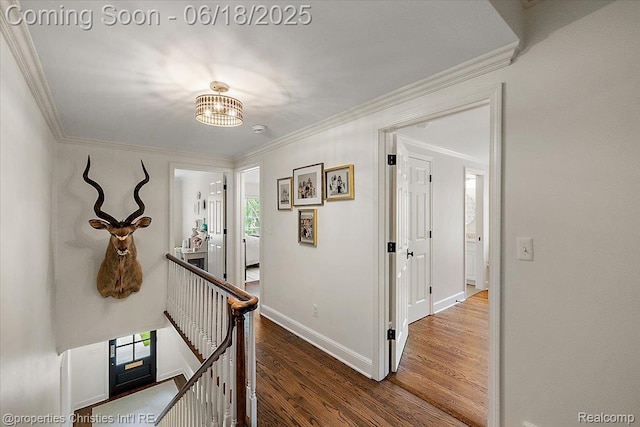 586 Fairfax St, Birmingham, MI 48009 - hallway with an upstairs landing, wood finished floors, ornamental molding, and a chandelier