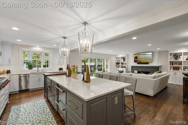 586 Fairfax St, Birmingham, MI 48009 - kitchen featuring white cabinets, a center island, plenty of natural light, recessed lighting, and crown molding