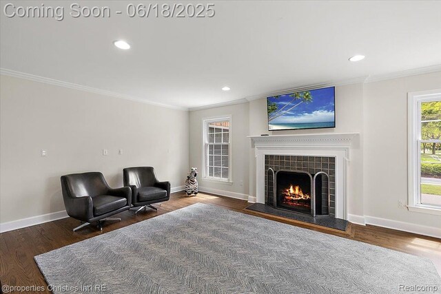 586 Fairfax St, Birmingham, MI 48009 - sitting room featuring crown molding, a tile fireplace, wood finished floors, and recessed lighting