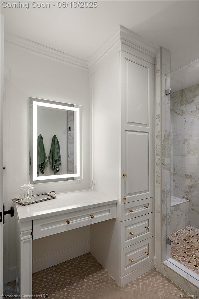 586 Fairfax St, Birmingham, MI 48009 - full bath featuring a marble finish shower, ornamental molding, brick patterned floors, and vanity