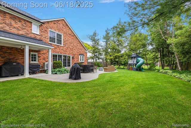 586 Fairfax St, Birmingham, MI 48009 - view of yard with a patio area and a playground