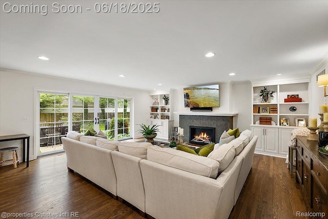 586 Fairfax St, Birmingham, MI 48009 - living room featuring crown molding, a tiled fireplace, dark wood-style flooring, recessed lighting, and built in features