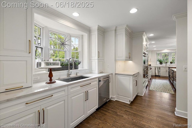586 Fairfax St, Birmingham, MI 48009 - kitchen featuring stainless steel dishwasher, dark wood-style floors, white cabinets, recessed lighting, and tasteful backsplash