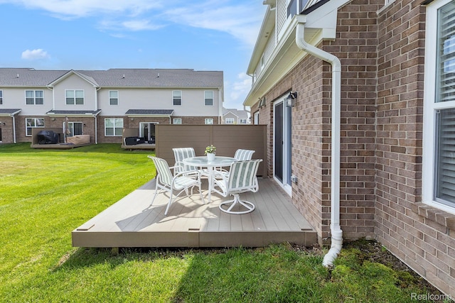 8797 Pioneer St, Washington, MI 48094 - wooden deck featuring a lawn and outdoor dining space