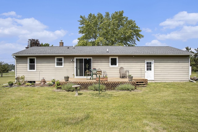 1602 Mccann Rd, Hastings, MI 49058 - back of house with a deck, a yard, a chimney, and a shingled roof