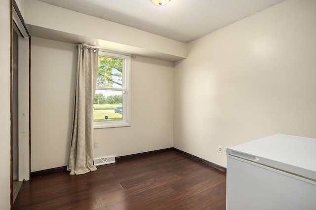 1602 Mccann Rd, Hastings, MI 49058 - empty room with dark wood-style floors and baseboards
