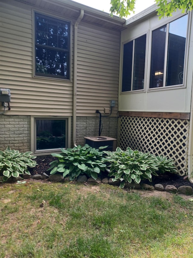 3144 Amsterdam Dr, Clio, MI 48420 - view of side of property featuring a central air condition unit