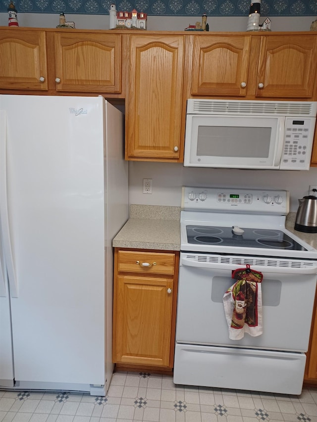 3144 Amsterdam Dr, Clio, MI 48420 - kitchen with white appliances and light countertops
