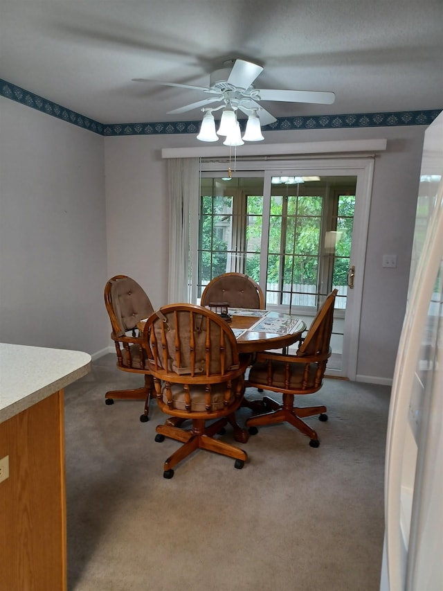 3144 Amsterdam Dr, Clio, MI 48420 - dining area with healthy amount of natural light, ceiling fan, and light carpet