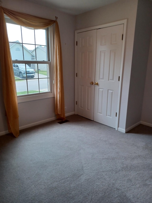 3144 Amsterdam Dr, Clio, MI 48420 - unfurnished bedroom featuring carpet flooring and a closet
