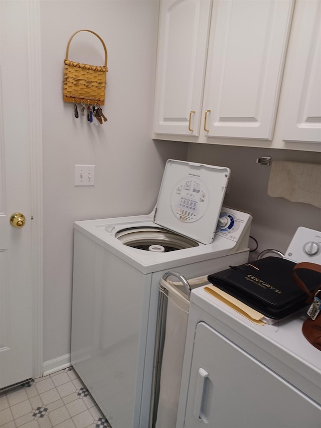3144 Amsterdam Dr, Clio, MI 48420 - laundry area with independent washer and dryer and cabinet space