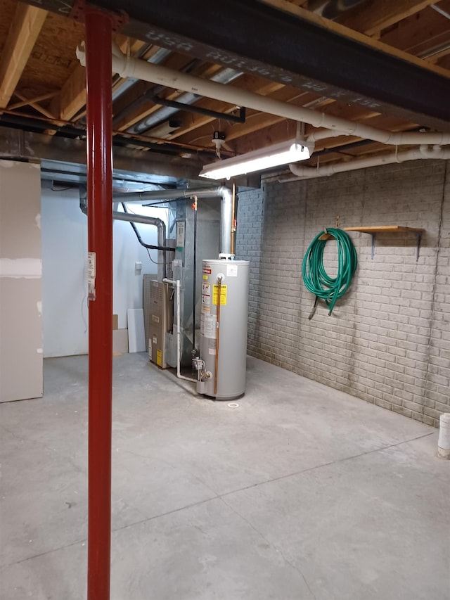 3144 Amsterdam Dr, Clio, MI 48420 - unfinished basement featuring gas water heater, brick wall, and heating unit