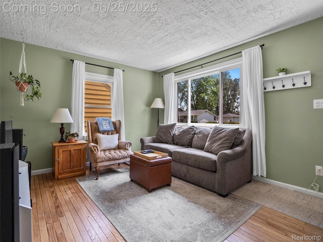 34286 Glover St, Wayne, MI 48184 - living area with hardwood / wood-style flooring and a textured ceiling