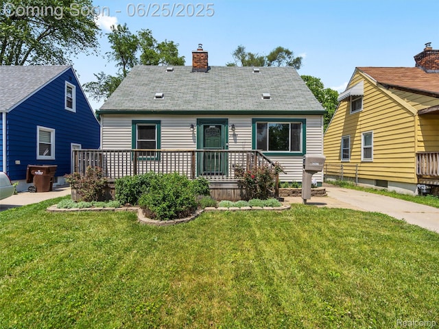 34286 Glover St, Wayne, MI 48184 - rear view of property with a lawn, a chimney, and a wooden deck