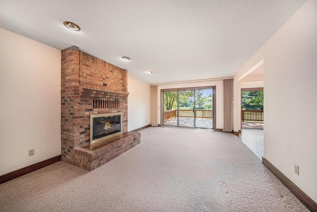 7385 Macomber Ct, Ann Arbor, MI 48103 - unfurnished living room with carpet floors and a brick fireplace