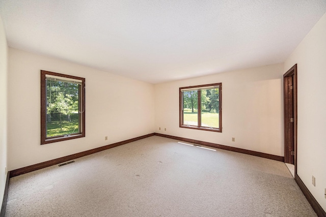 7385 Macomber Ct, Ann Arbor, MI 48103 - unfurnished room with light carpet and baseboards