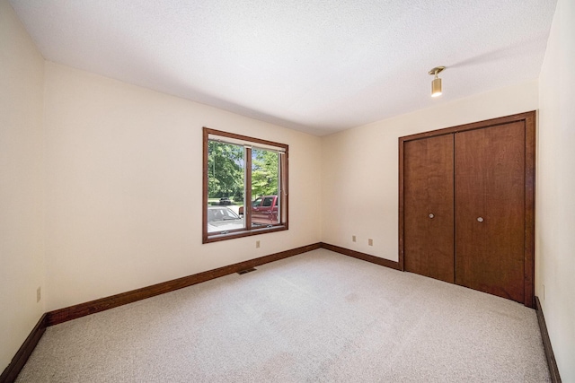 7385 Macomber Ct, Ann Arbor, MI 48103 - unfurnished bedroom with light colored carpet and a closet