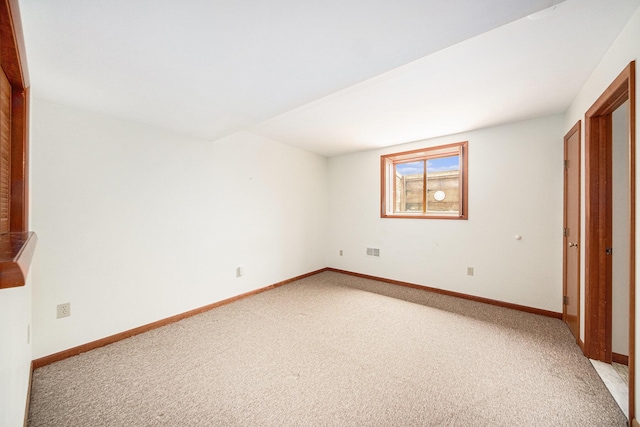 7385 Macomber Ct, Ann Arbor, MI 48103 - unfurnished bedroom featuring light carpet and baseboards