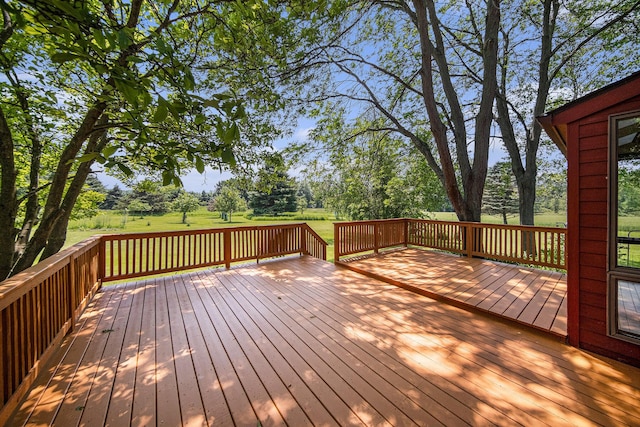 7385 Macomber Ct, Ann Arbor, MI 48103 - deck featuring view of scattered trees and a lawn