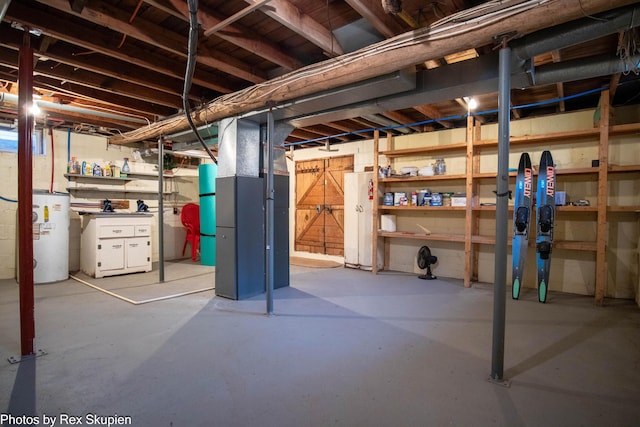 4767 S River St, Newaygo, MI 49337 - unfinished basement featuring water heater and heating unit
