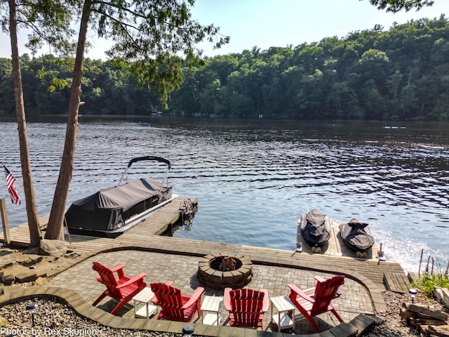 4767 S River St, Newaygo, MI 49337 - dock area featuring an outdoor fire pit, a water view, and a forest view
