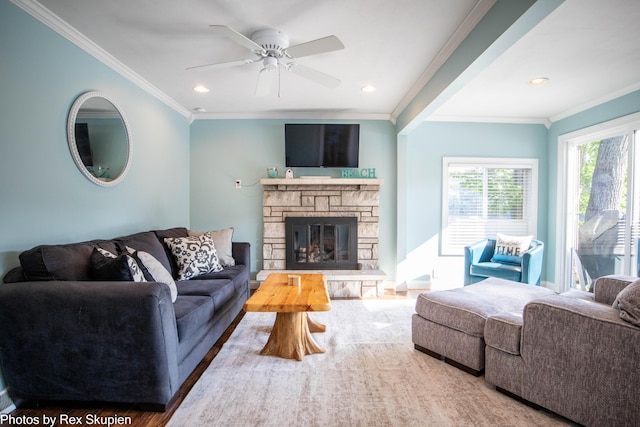 4767 S River St, Newaygo, MI 49337 - living room featuring wood finished floors, crown molding, a ceiling fan, a stone fireplace, and recessed lighting