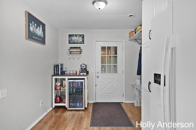 37137 30th St, Paw Paw, MI 49079 - bar featuring white fridge with ice dispenser and light wood-style floors