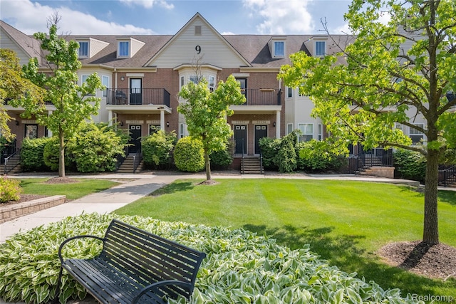 25556 Portico Ln, Novi, MI 48375 - multi unit property featuring brick siding and a front lawn