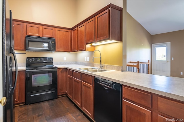 25556 Portico Ln, Novi, MI 48375 - kitchen featuring black appliances, dark wood-style floors, light countertops, and brown cabinets