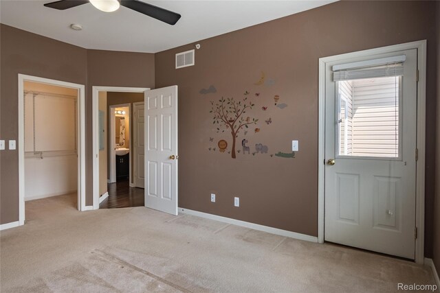 25556 Portico Ln, Novi, MI 48375 - unfurnished bedroom with light carpet, a ceiling fan, and a closet