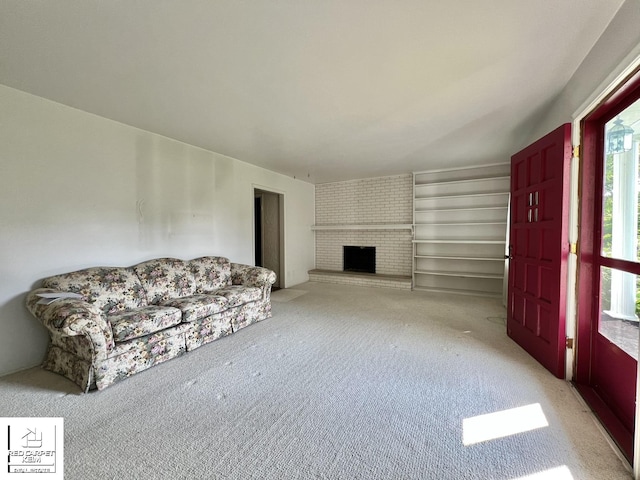 7379 N Irish Rd, Otisville, MI 48463 - living room featuring light colored carpet and a fireplace