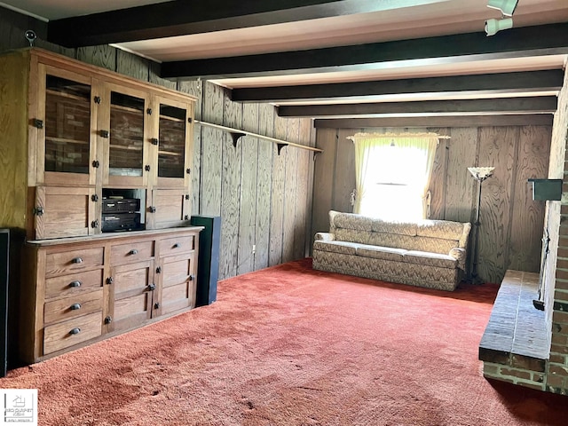 7379 N Irish Rd, Otisville, MI 48463 - sitting room with wood walls, carpet, and beam ceiling