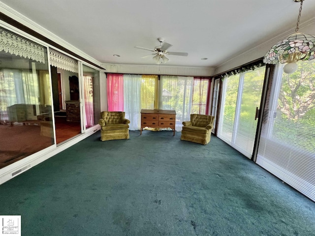 7379 N Irish Rd, Otisville, MI 48463 - sunroom / solarium with a ceiling fan, carpet, healthy amount of natural light, and crown molding