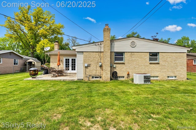 15615 S Midway Ave, Allen Park, MI 48101 - back of house featuring a chimney, brick siding, a patio, and french doors