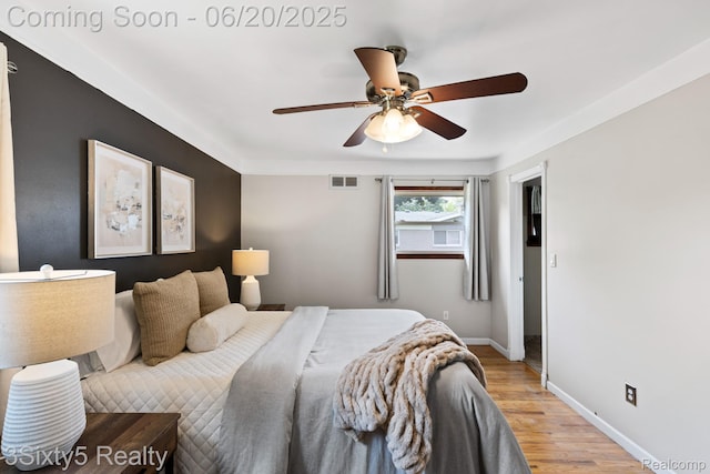 15615 S Midway Ave, Allen Park, MI 48101 - bedroom with light wood-type flooring and ceiling fan