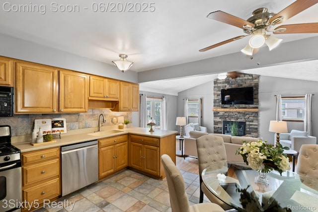 15615 S Midway Ave, Allen Park, MI 48101 - kitchen featuring appliances with stainless steel finishes, lofted ceiling, tasteful backsplash, a ceiling fan, and light countertops