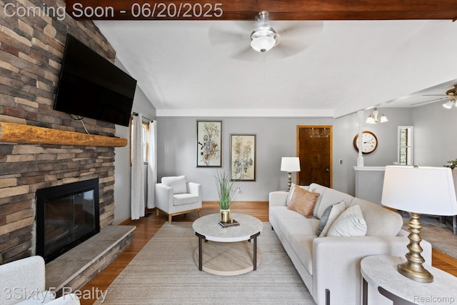 15615 S Midway Ave, Allen Park, MI 48101 - living area with a ceiling fan, vaulted ceiling, wood finished floors, and a stone fireplace