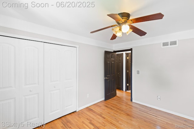 15615 S Midway Ave, Allen Park, MI 48101 - unfurnished bedroom featuring a closet, light wood-style flooring, and ceiling fan