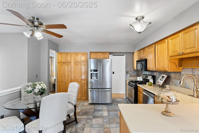 15615 S Midway Ave, Allen Park, MI 48101 - kitchen with stainless steel appliances, ceiling fan, light countertops, and decorative backsplash