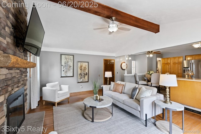 15615 S Midway Ave, Allen Park, MI 48101 - living room featuring a ceiling fan, wood finished floors, and a large fireplace