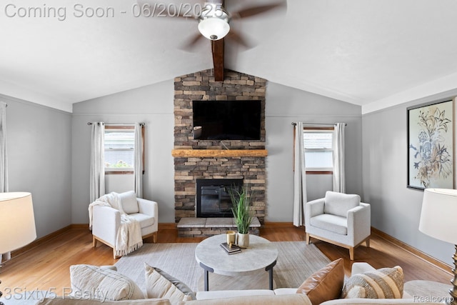 15615 S Midway Ave, Allen Park, MI 48101 - living area with ceiling fan, a stone fireplace, and wood finished floors