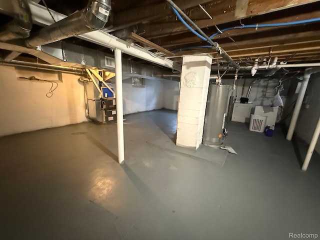9208 Ward St, Detroit, MI 48228 - unfinished below grade area featuring water heater and heating unit