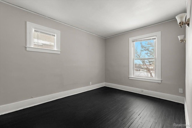4334 Pacific St, Detroit, MI 48204 - spare room featuring healthy amount of natural light, ornamental molding, and dark wood finished floors