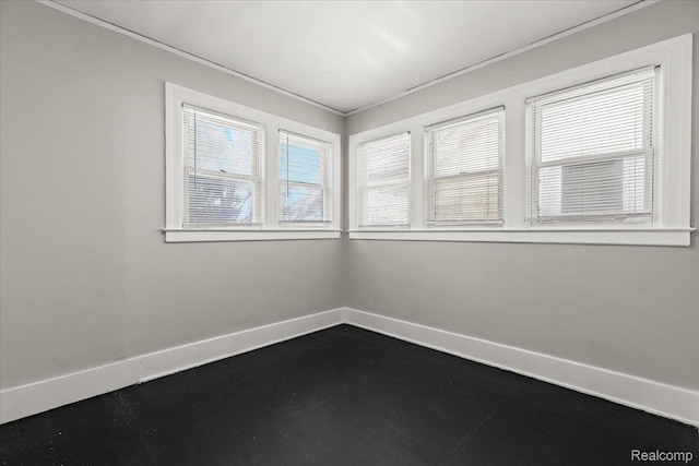 4334 Pacific St, Detroit, MI 48204 - spare room with baseboards and crown molding