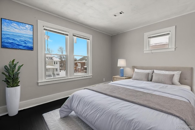 4334 Pacific St, Detroit, MI 48204 - bedroom featuring multiple windows, dark wood-type flooring, and crown molding