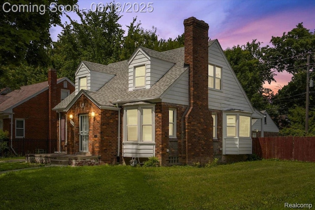 11108 Craft St, Detroit, MI 48224 - new england style home with brick siding, a chimney, and roof with shingles