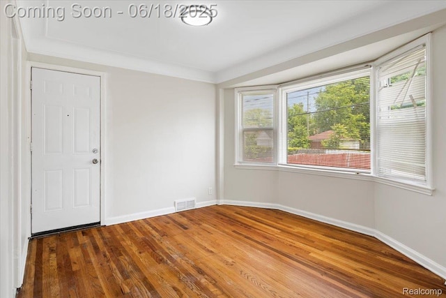11108 Craft St, Detroit, MI 48224 - unfurnished room with healthy amount of natural light and wood finished floors