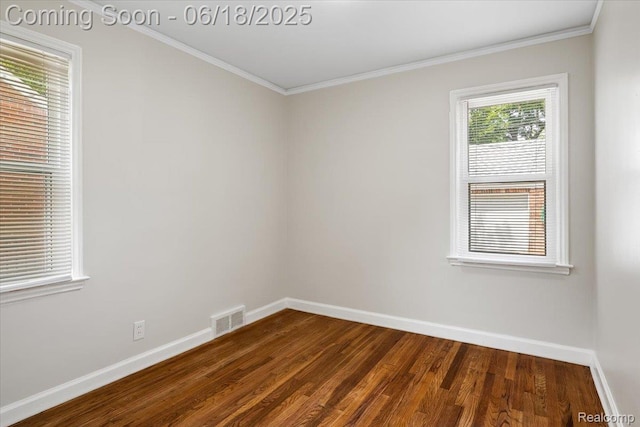 11108 Craft St, Detroit, MI 48224 - empty room with dark wood finished floors and crown molding