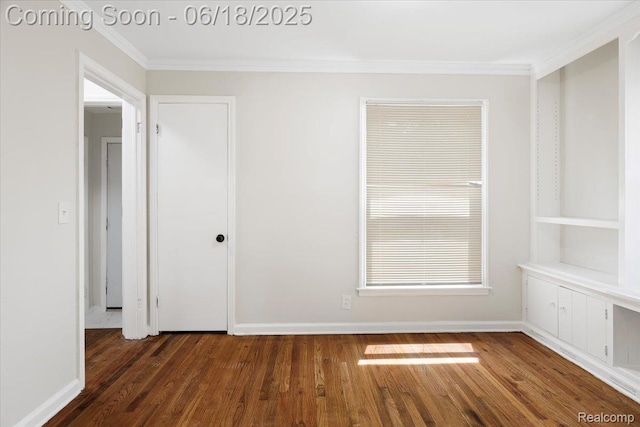 11108 Craft St, Detroit, MI 48224 - spare room featuring ornamental molding and dark wood-type flooring