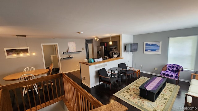 870 Lothrop Rd Unit 6/1, Detroit, MI 48202 - kitchen with stainless steel fridge with ice dispenser and wood finished floors